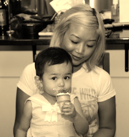 Me with the birthday girl, who is totally loving the cone cupcake =)