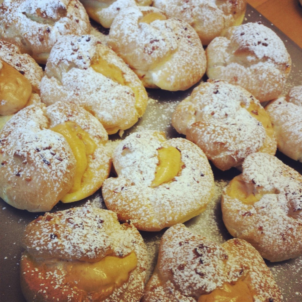 Spiced pumpkin filled cream puffs with powdered sugar